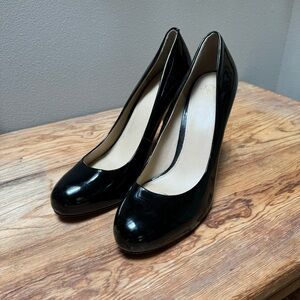 Joan & David black leather patent pumps